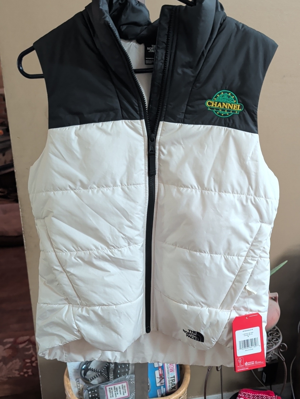 The North Face White and Black Down Puffer Vest with Green Logo Patch
